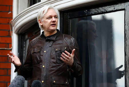 FILE PHOTO - WikiLeaks founder Julian Assange is seen on the balcony of the Ecuadorian Embassy in London, Britain, May 19, 2017. REUTERS/Neil Hall