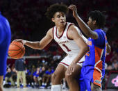 Oklahoma forward Jalen Hill (1) pushes past Florida guard Tyree Appleby during the second half of an NCAA college basketball game in Norman, Okla., Wednesday, Dec. 1, 2021. (AP Photo/Kyle Phillips)