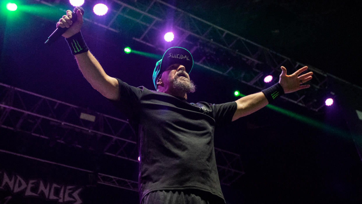  Mike Muir strikes a pose on stage. 