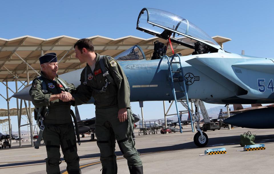 Capt. David Vincent, right, congratulates retired Air Force Brig. Gen. Charles Yeager following their F-15D re-enactment flight commemorating Yeager's breaking of the sound barrier 65 years ago on Sunday, Oct. 14, 2012, at Nellis Air Force Base, Nev. 