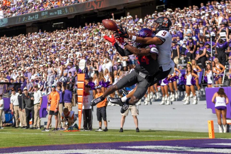 TCU cornerback Josh Newton blocks a potential touchdown from Oklahoma State wide receiver Bryson Green during their football game at the Amon G. Carter Stadium on Oct. 15.
