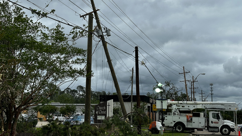 Utility pole are seen leaning over after a tornado tore through Slidell, Louisiana, on Wednesday, April 10, 2024.
