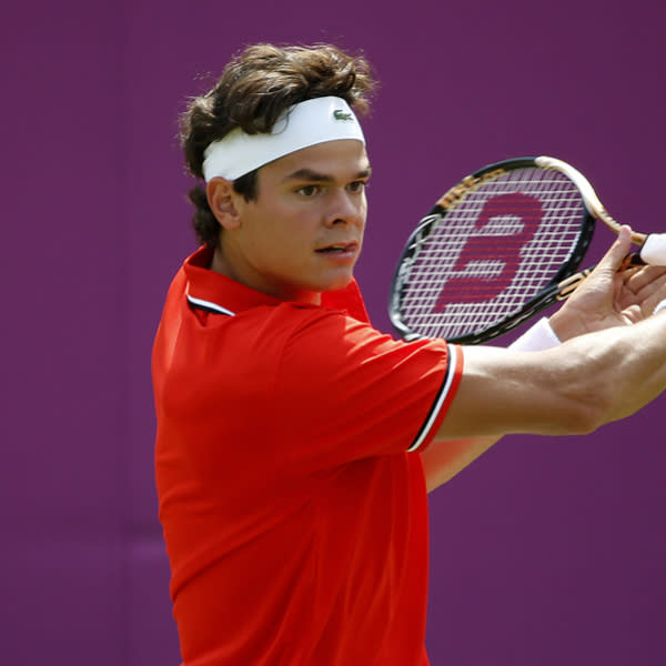 LONDON, ENGLAND - JULY 30: Milos Raonic of Canada plays a backhand during the Men's Singles Tennis match against Tatsuma Ito of Japan on Day 3 of the London 2012 Olympic Games at the All England Lawn Tennis and Croquet Club in Wimbledon on July 30, 2012 in London, England. (Photo by Jamie Squire/Getty Images)