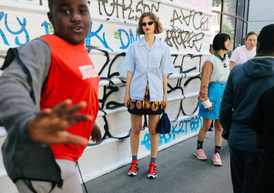 <h1 class="title">Giedre Dukauskaite in a Prada skirt with a Prada bag and Salomon sneakers</h1><cite class="credit">Photographed by Phil Oh</cite>