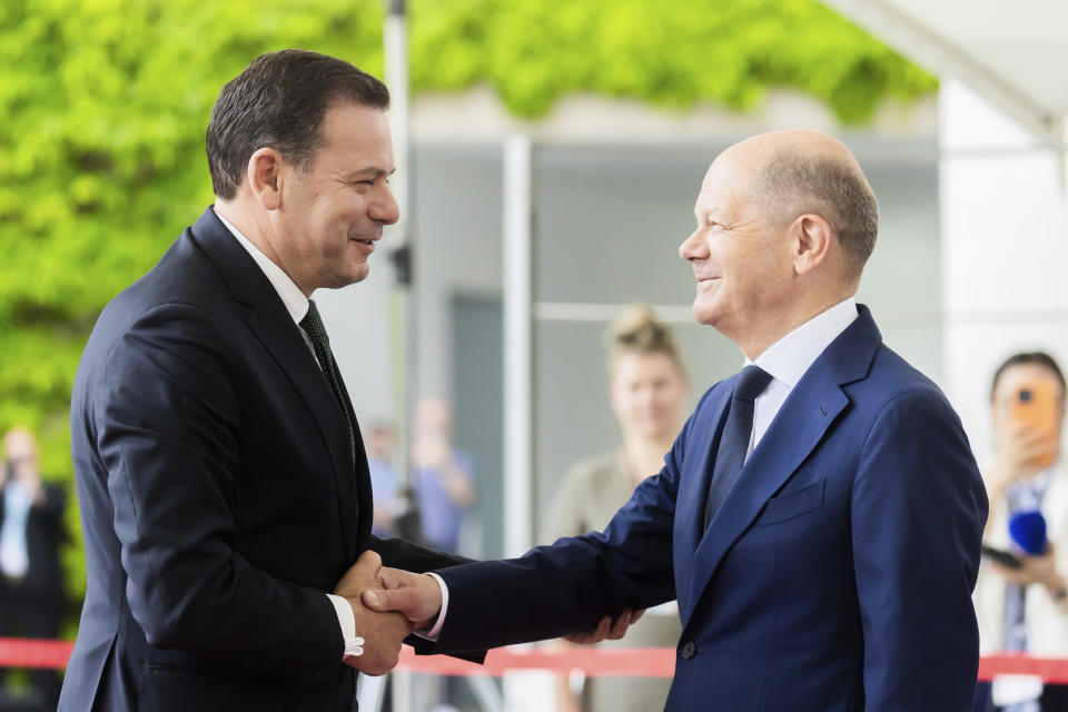 German Chancellor Olaf Scholz, right, welcomes Portugal's Prime Minister Luis Montenegro during their meeting at the Federal Chancellery in Berlin, Friday, May 24, 2024. (Christoph Soeder/dpa via AP)