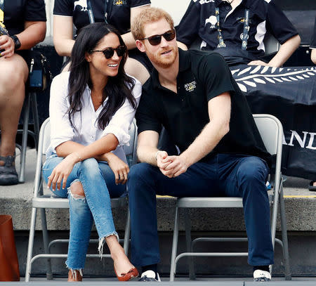 Prince Harry arrives with Meghan Markle. REUTERS/Mark Blinch