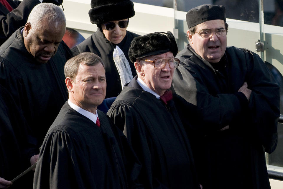 Stevens (center) attends the inauguration of President Barack Obama in 2009. Standing around him (clockwise from his immediate left) are Chief Justice John Roberts and Justices Clarence Thomas, Ruth Bader Ginsburg and Antonin Scalia. (Photo: Bloomberg via Getty Images)