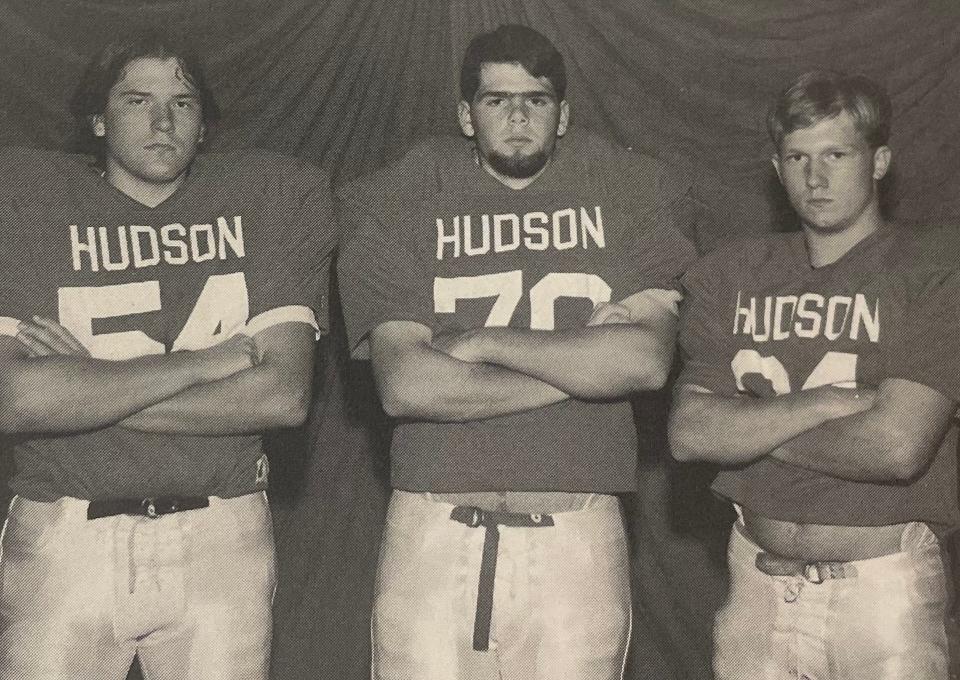 Hudson High's Class of 1998 captains, from left, Kris Munroe, Aaron Cohen and Joe Edie, who has two sons on this year's team.