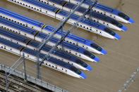 Bullet trains are seen submerged in muddy waters in Nagano, central Japan, after Typhoon Hagibis hit the city, Sunday, Oct. 13, 2019. Rescue efforts for people stranded in flooded areas are in full force after a powerful typhoon dashed heavy rainfall and winds through a widespread area of Japan, including Tokyo.(Yohei Kanasashi/Kyodo News via AP)
