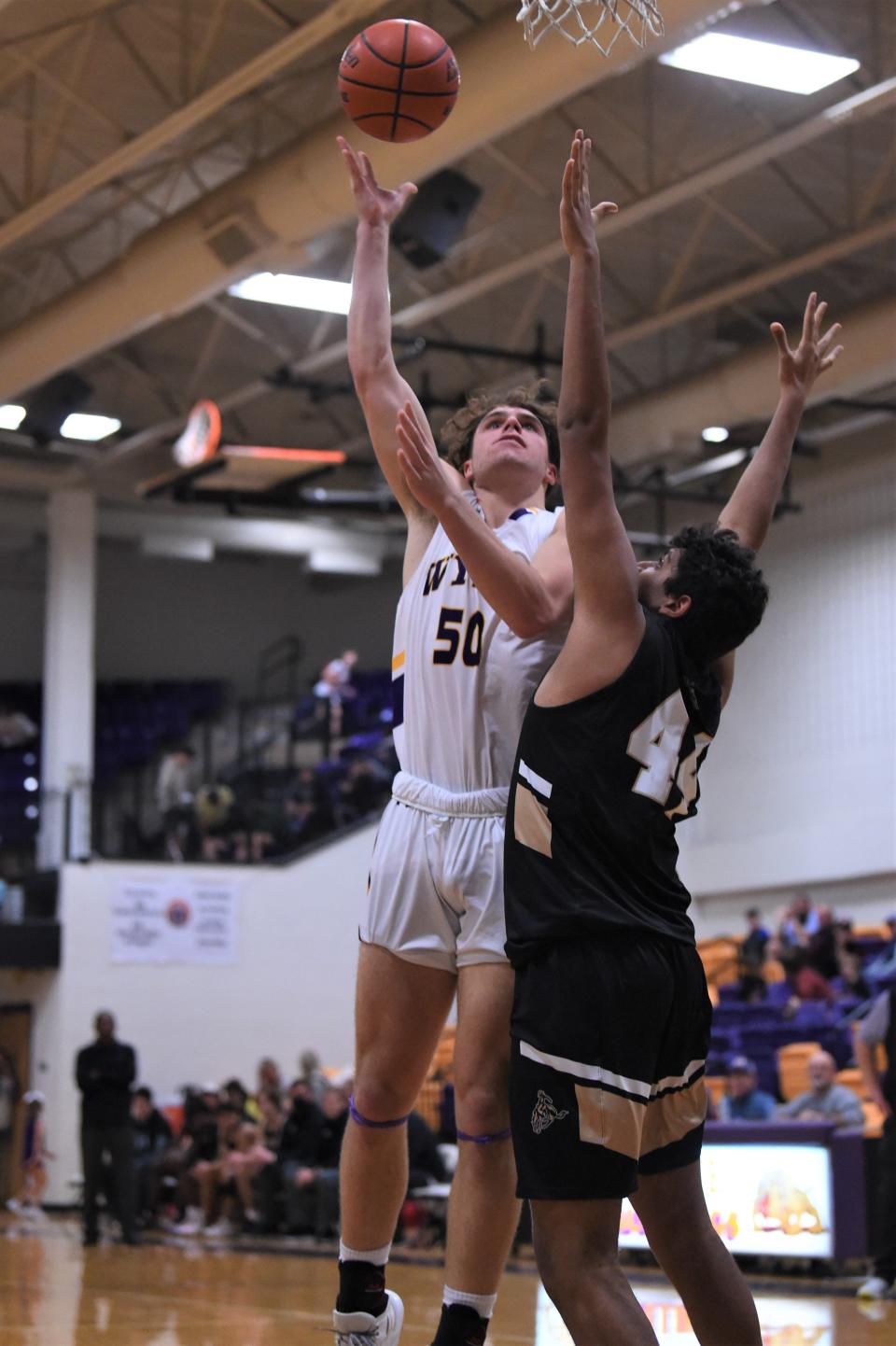 Wylie's Avery Brekke (50) lets go of a shot during Tuesday's game against Lubbock High. Brekke scored a game-high 29 points as the Bulldogs improved to 2-0 in District 4-5A in the 66-57 victory.