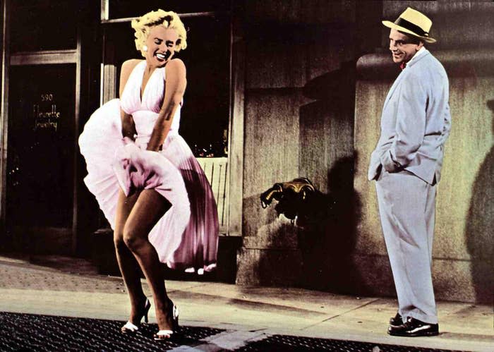 Marilyn Monroe poses over a grate which blows her dress up. The scene is from the movie "The Seven Year Itch"