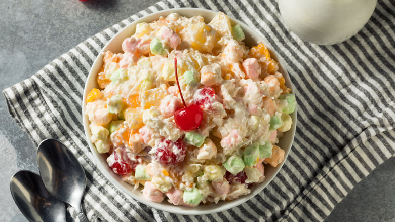 Bowl of ambrosia salad on striped towel