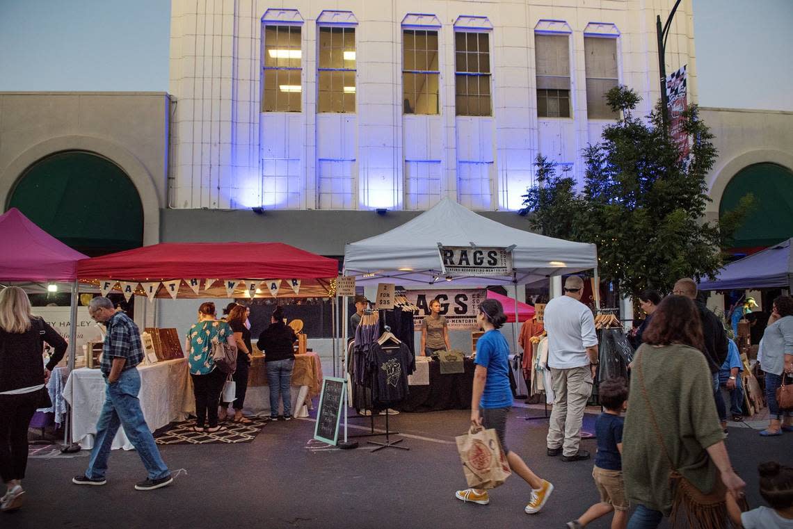 In this photo from 2018, people shop, enjoy music and other entertainment on 10th Street during the DoMo First Fridays market.