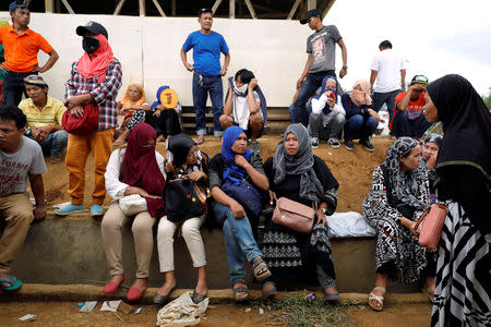 Voters wait outside a makeshift polling precint for internally displaced people in Marawi City, Lanao Del Sur province, Philippines, May 13, 2019. REUTERS/Eloisa Lopez