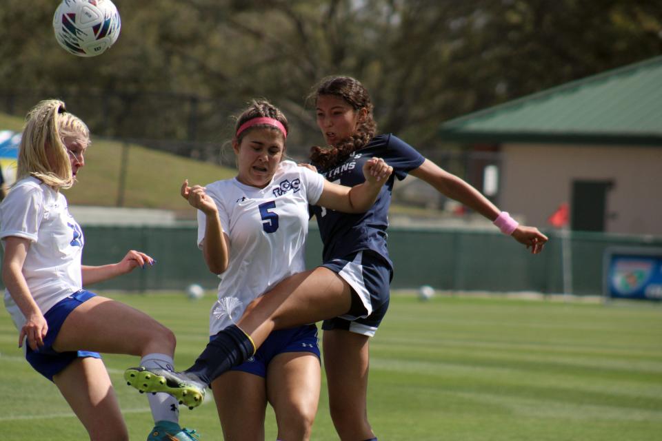 St. Johns Country Day midfielder Camila Adame (15) clears the ball against Lakeland Christian in the 2023 Class 2A state final.