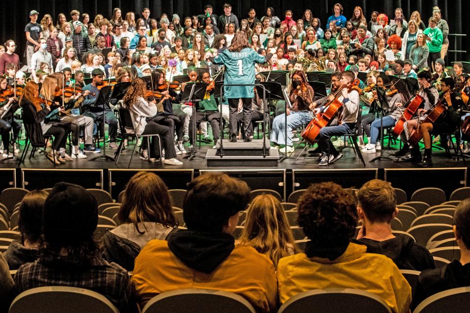 Guest conductor Dr. Veronica Perrine, principal of Odessa High School (and a former Arts Educator), directs an ensemble of approximately 250 music students, ranging in age from 5 to 18, and staff in a rendition of the Eagle's fight son, "Fly Eagles Fly" at the Fairview Performing Arts Center in Townsend, Tuesday, Feb. 7, 2023.