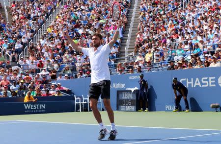 Aug 31, 2014; New York, NY, USA; Gilles Simon (FRA) celebrates defeating David Ferrer (ESP) in four sets on Armstrong Stadium on day seven of the 2014 U.S. Open tennis tournament at USTA Billie Jean King National Tennis Center. Anthony Gruppuso-USA TODAY Sports