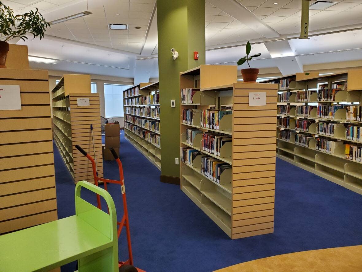 Staff at the Kennebecasis Public Library have been busy reshelving books in preparation for its reopening on Aug. 23.  (Submitted by Norah Emerson  - image credit)