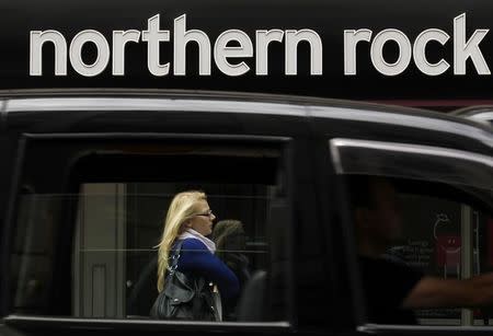 A black cab drives past a branch of Northern Rock in the City of London, August 3, 2010. REUTERS/Andrew Winning