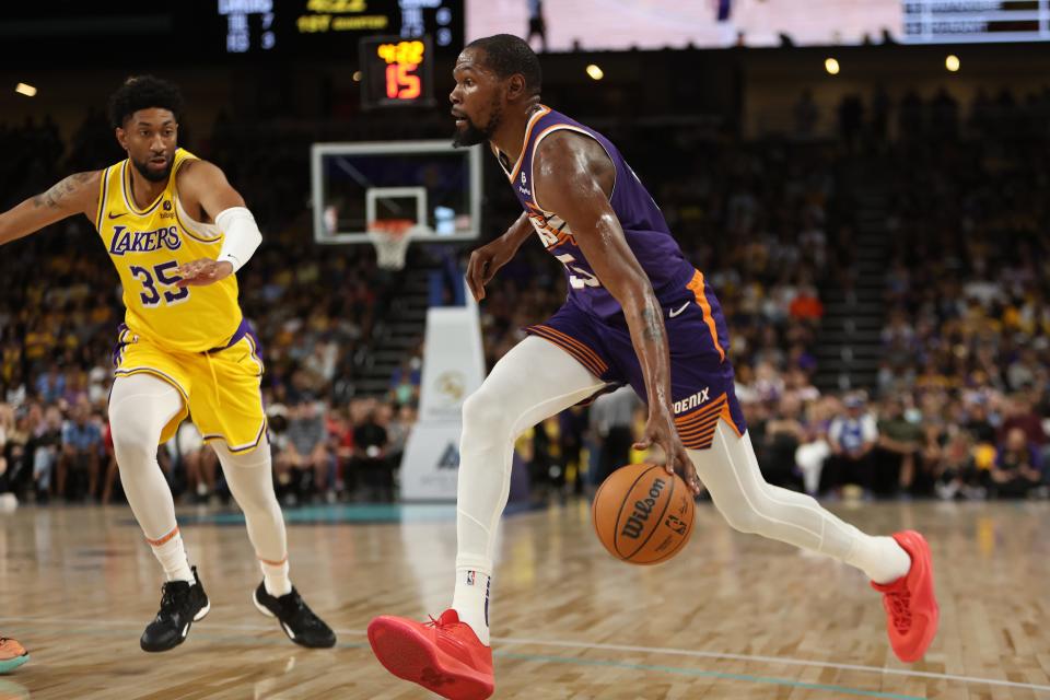 Phoenix Suns forward Kevin Durant (35) drives to the basket against Los Angeles Lakers forward Christian Wood (35) during the first quarter at Acrisure Arena in Palm Desert, Calif., on Oct. 19, 2023.