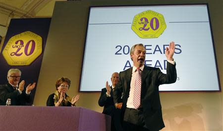 The leader of the UK Independence Party (UKIP), Nigel Farage (R), waves at the close of his keynote speech at the party's annual conference in central London September 20, 2013. REUTERS/Luke MacGregor