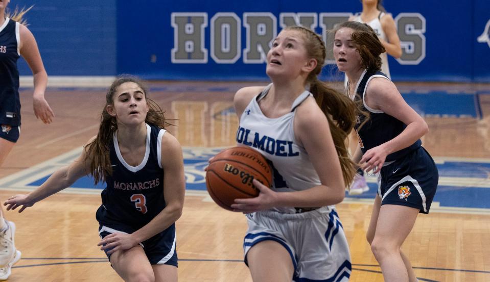 Holmdel Erica Stolker drives to the basket. Holmdel Girls Basketball defeats Trinity Hall in Holmdel, NJ on January 25, 2022. 