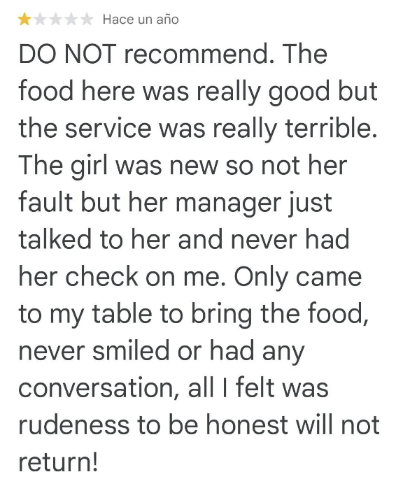 A 1-star review stating the food at this restaurant was good but the service was terrible due to a lack of attentiveness and rudeness from the staff, particularly the manager