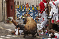 <p>A reveler is gored during the running of the bulls in Pamplona, Spain, July 8, 2016. (Photo: Daniel Ochoa de Olza/AP) </p>