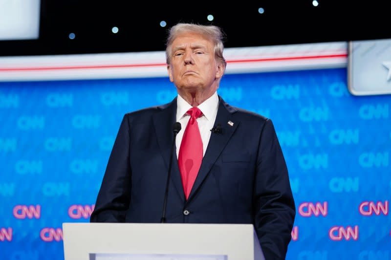 Former President Donald Trump stands on the stage during a break in the CNN presidential election debate against President Joe Biden in Atlanta on Thursday. Photo by Elijah Nouvelage/UPI