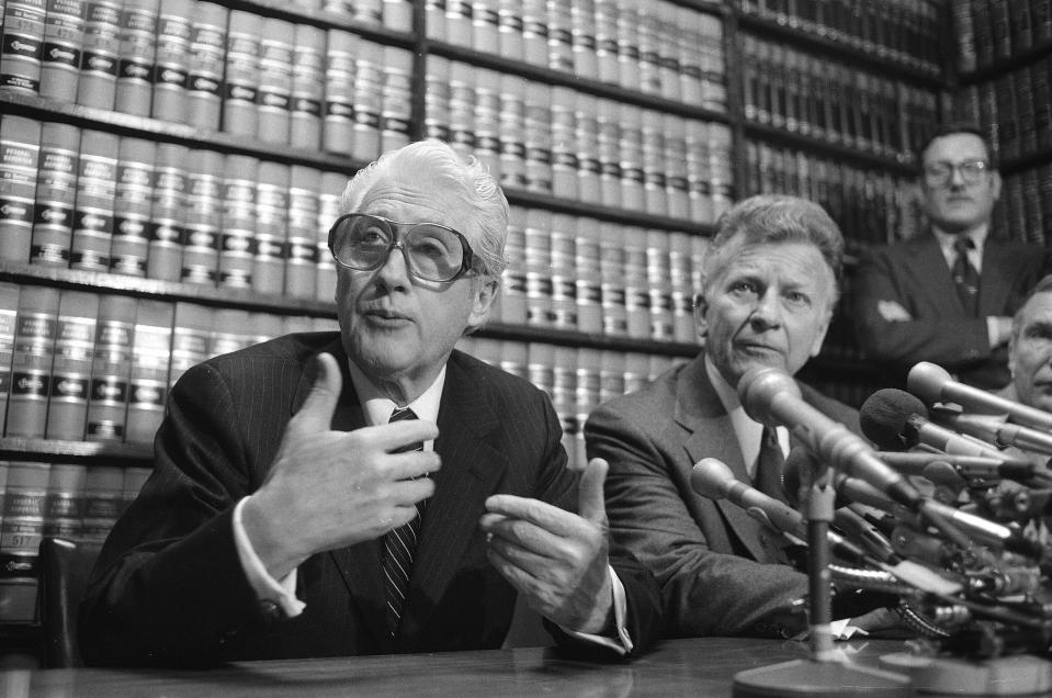 FILE - Former FBI officials, Mark Felt, left, and Edward S. Miller, appear at a news conference, in April 15, 1981 after learning that President Ronald Reagan had pardoned them from their conviction of unauthorized break-ins during the Nixon administration's search for opponents during the Vietnam War. (AP Photo/Bob Daugherty, File)