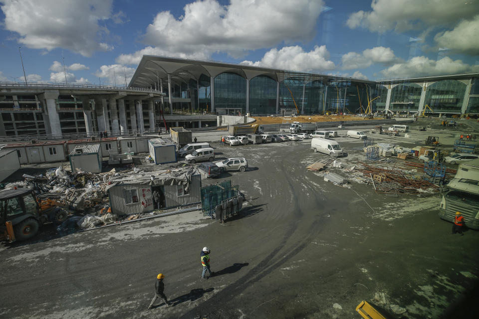 FILE - In this Oct. 25, 2018, file photo, construction continues in Istanbul's new airport ahead of its opening. The first phase of the airport, one of Turkey's President Recep Tayyip Erdogan's major construction projects, is scheduled to be inaugurated on Oct. 29, 2018 when Turkey celebrates Republic Day. The massive project, has been mired in controversy over worker's rights and environmental concerns amid a weakening economy. (AP Photo/Emrah Gurel, File)