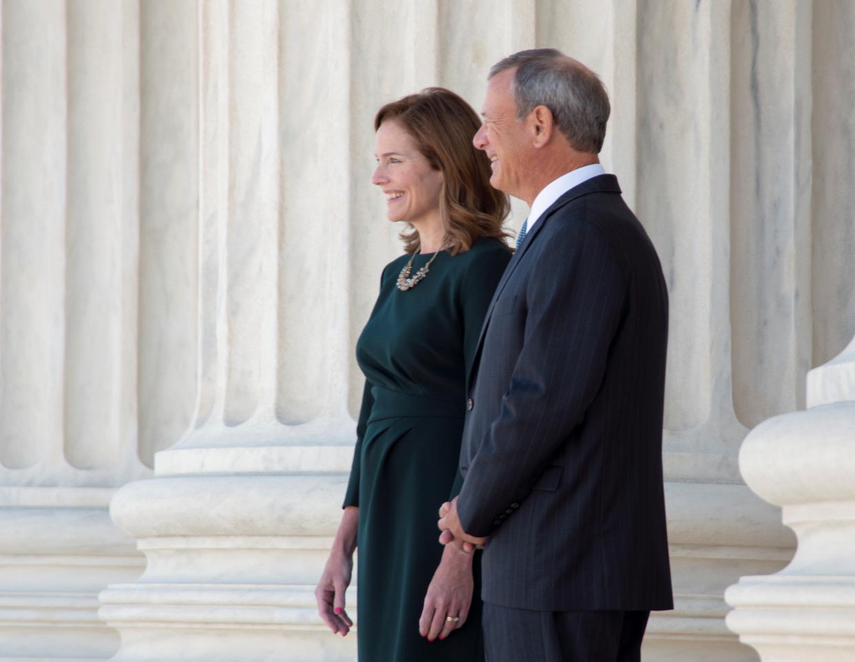 U.S. Supreme Court Associate Justice Amy Coney Barrett walks out onto the front portico of the court with Chief Justice John Roberts after her formal investiture ceremony in the courtroom at the Supreme Court in Washington, U.S. October 1, 2021. Franz Jantzen, Collection of the Supreme Court of the United States/Handout via REUTERS    THIS IMAGE HAS BEEN SUPPLIED BY A THIRD PARTY NO COMMERCIAL SALES  EDITORIAL USE ONLY 