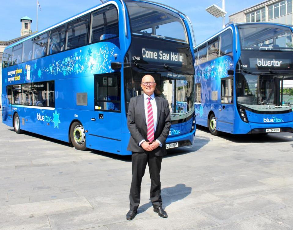 Daily Echo: Andrew Wickham with two of the new buses 