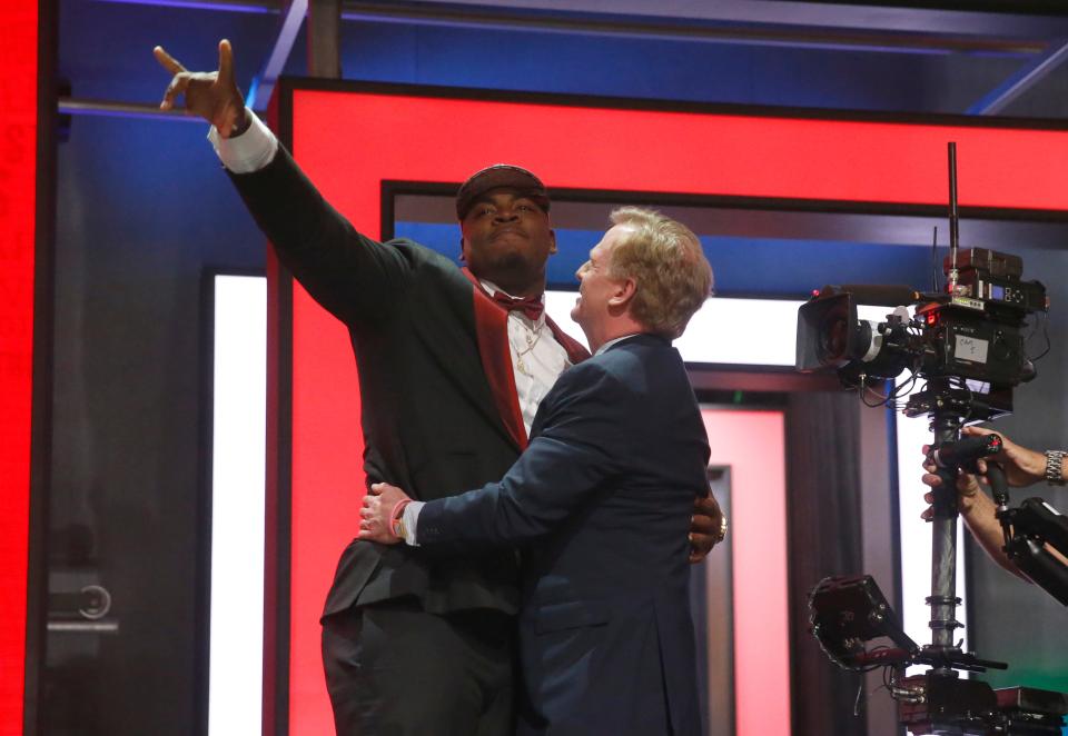 Mississippi State’s Chris Jones celebrates with NFL Commissioner Roger Goodell after being selected by the Kansas City Chiefs as the 37th pick in the second round of the 2016 NFL football draft, Friday, April 29, 2016, in Chicago. (AP Photo/Charles Rex Arbogast)