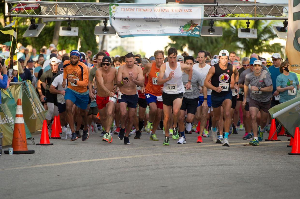 Runners begin the 5K race during the 2021 Town of Palm Beach United Way Turkey Trot. Registration is open for this year's event.