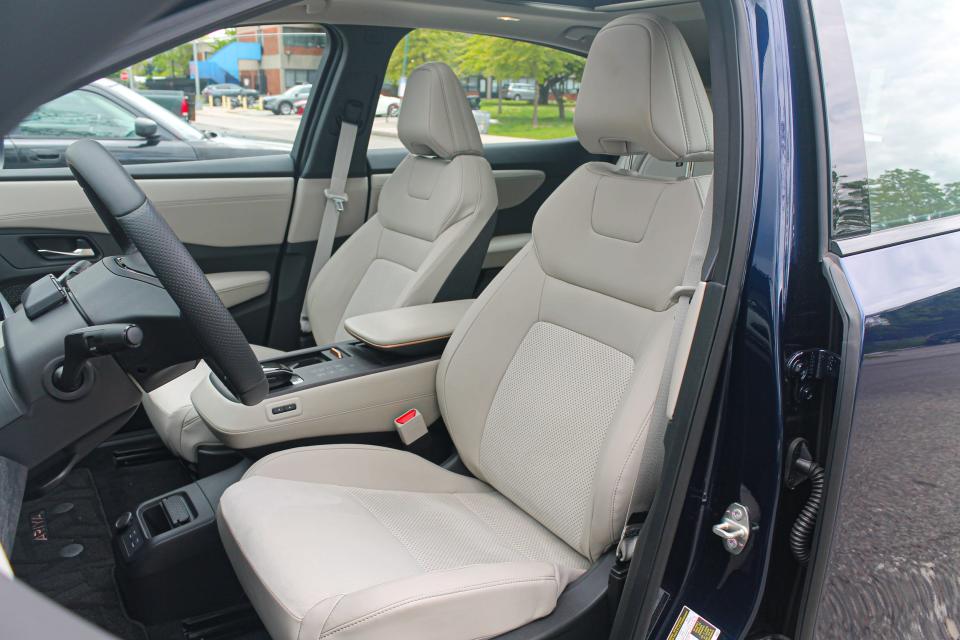 White leather seats in the 2023 Nissan Ariya Empower+ electric SUV.