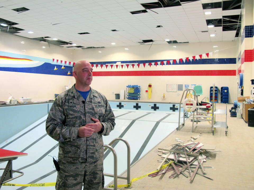 Air Force Col. Michael Staples shows damage from the powerful Nov. 30 earthquake, at Joint Base Elmendorf-Richardson Friday, Dec. 7, 2018, in Anchorage, Alaska. The magnitude 7.0 earthquake caused multiple problems around the base, including damage to steel frameworks, ceilings, and sprinkler and heating systems, but no catastrophic damage. (AP Photo/Rachel D'Oro)