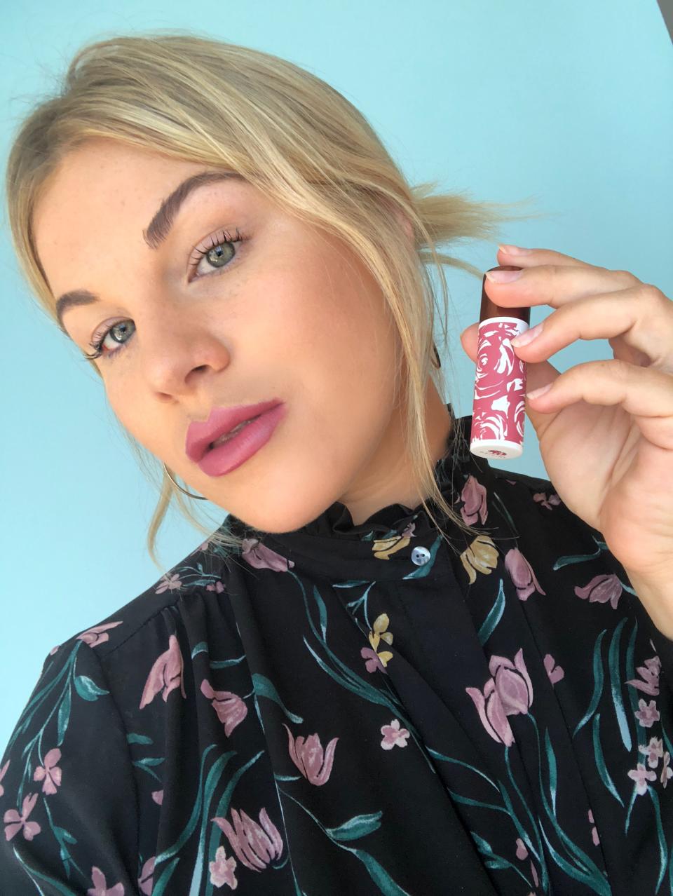 Allure editor Madisen Theobald wearing the Origins Blooming lipstick in Pretty Petunia