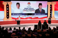 Indonesia's presidential candidate Joko Widodo (L) speaks during a debate with his opponent Prabowo Subianto (R) in Jakarta, Indonesia, February 17, 2019. REUTERS/Willy Kurniawan