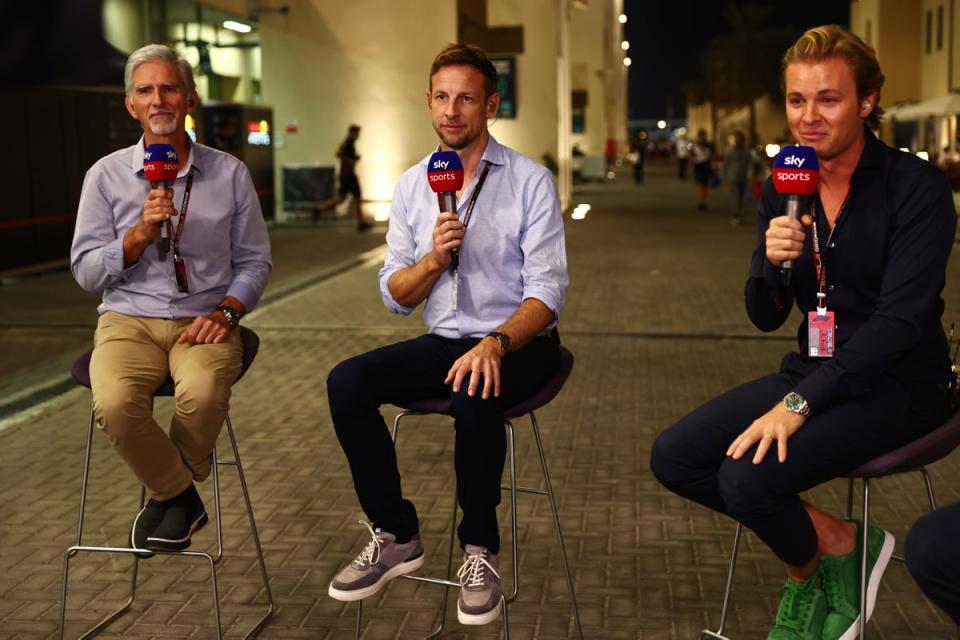 The 2009 world champion (centre) now works for Sky Sports as a pundit and co-commentator (Getty Images)