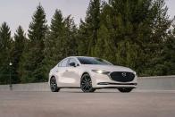 <p>For buyers with champagne taste but only a sparkling-cider budget, the 2022 Mazda 3 delivers a premium package at a normal compact-car price. It's offered both as a sedan and a hatchback and can be equipped with optional all-wheel drive, a punchy turbo engine, and <a href="https://www.caranddriver.com/reviews/comparison-test/a35123689/2021-mazda-3-vs-2021-audi-a4/" rel="nofollow noopener" target="_blank" data-ylk="slk:enough upscale features to be taken seriously;elm:context_link;itc:0;sec:content-canvas" class="link ">enough upscale features to be taken seriously</a> among small <a href="https://www.caranddriver.com/audi/a3" rel="nofollow noopener" target="_blank" data-ylk="slk:Audis;elm:context_link;itc:0;sec:content-canvas" class="link ">Audis</a>, <a href="https://www.caranddriver.com/bmw/2-series-gran-coupe" rel="nofollow noopener" target="_blank" data-ylk="slk:BMWs;elm:context_link;itc:0;sec:content-canvas" class="link ">BMWs</a>, and <a href="https://www.caranddriver.com/mercedes-benz/a-class" rel="nofollow noopener" target="_blank" data-ylk="slk:Benzes;elm:context_link;itc:0;sec:content-canvas" class="link ">Benzes</a>. Entry-level models are, of course, not as posh, but the 3 looks handsome, and its playful personality will win over enthusiast drivers, even with front-wheel drive and base engine on board. That's why we put it on <a href="https://www.caranddriver.com/features/a38873223/2022-editors-choice/" rel="nofollow noopener" target="_blank" data-ylk="slk:our 2022 Editors' Choice list;elm:context_link;itc:0;sec:content-canvas" class="link ">our 2022 Editors' Choice list</a>. Although it is priced similarly to rivals such as the <a href="https://www.caranddriver.com/honda/civic" rel="nofollow noopener" target="_blank" data-ylk="slk:Honda Civic;elm:context_link;itc:0;sec:content-canvas" class="link ">Honda Civic</a>, the <a href="https://www.caranddriver.com/toyota/corolla" rel="nofollow noopener" target="_blank" data-ylk="slk:Toyota Corolla;elm:context_link;itc:0;sec:content-canvas" class="link ">Toyota Corolla</a>, and the <a href="https://www.caranddriver.com/volkswagen/jetta" rel="nofollow noopener" target="_blank" data-ylk="slk:Volkswagen Jetta;elm:context_link;itc:0;sec:content-canvas" class="link ">Volkswagen Jetta</a>, the Mazda offers a level of sophistication and style that those cars can't match.<br></p><p><a class="link " href="https://www.caranddriver.com/mazda/mazda-3" rel="nofollow noopener" target="_blank" data-ylk="slk:Review, Pricing, and Specs;elm:context_link;itc:0;sec:content-canvas">Review, Pricing, and Specs</a></p>