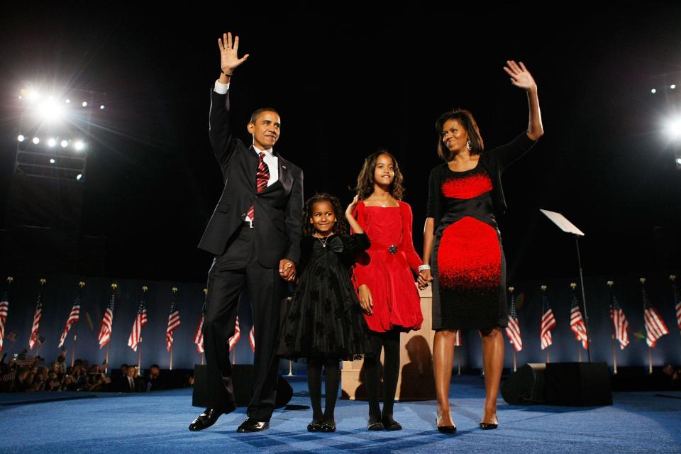 November 2008: On election night, Michelle Obama stood on stage alongside her family wearing a red-and-black sheath by Narciso Rodriguez.