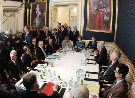 French Foreign Minister Laurent Fabius (3rd L), EU envoy Catherine Ashton (6th L), U.S. Secretary of State John Kerry (3rd R) and Britain's Foreign Secretary Philip Hammond (front L) sit a a table during talks in Vienna November 21, 2014. REUTERS/Heinz-Peter Bader