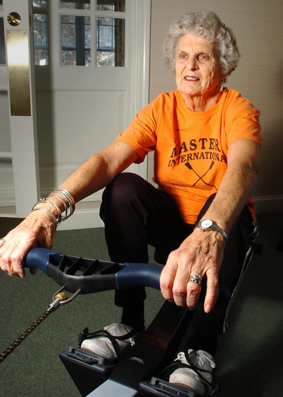 Marjorie Burgard, then 81, works out on a rower at the Village at Duxbury, where she lived. She died at age 93 in 2022.