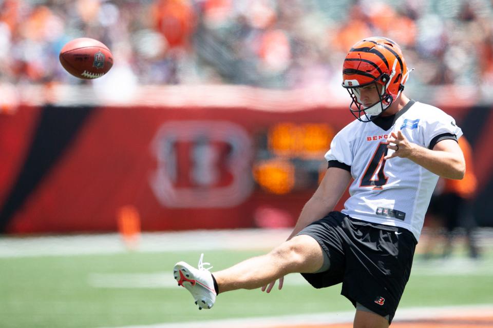 Cincinnati Bengals punter Drue Chrisman (4) warms up during preseason training camp at Paul Brown Stadium July 30, 2022. He comes to the Bengals from Ohio State University football, where he played after winning two Division II state titles with La Salle High School.