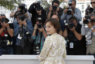 Actress Kristen Scott Thomas poses for photographers during a photo call for the film Only God Forgives at the 66th international film festival, in Cannes, southern France, Wednesday, May 22, 2013. (AP Photo/Lionel Cironneau)