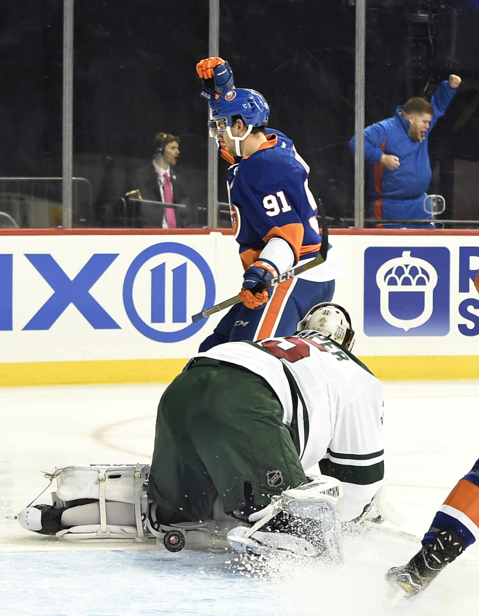 New York Islanders center John Tavares (91) celebrates his goal against Minnesota Wild goalie Darcy Kuemper (35) in the second period of an NHL hockey game in New York, Sunday, Oct. 23, 2016. The Islanders won 6-3. (AP Photo/Kathy Kmonicek)