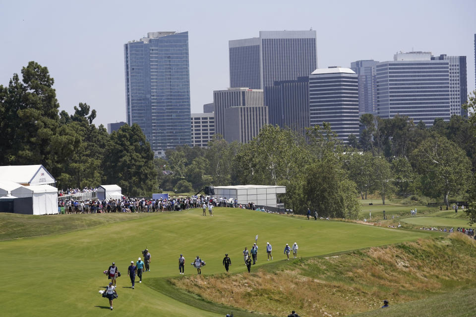 Golfers walk on the third hole during the second round of the U.S. Open golf tournament at Los Angeles Country Club on Friday, June 16, 2023, in Los Angeles. (AP Photo/Marcio J. Sanchez)