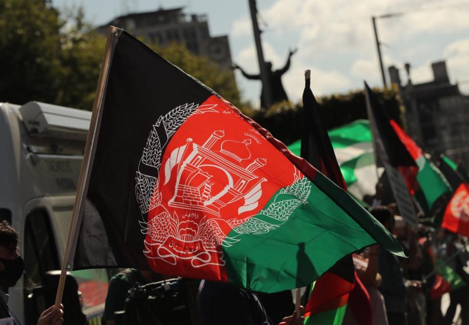 People waving Afghan flags attend a protest against Taliban persecution of women on Dublins O’Connell Street organized by the Afghan Union of Ireland. Picture date: Sunday September 19, 2021. (PA Archive)