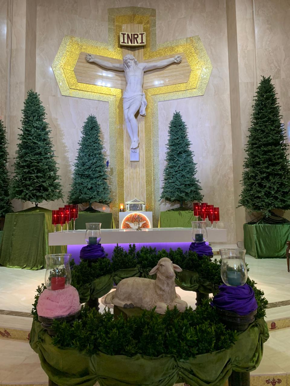 The altar at St. Thomas More Catholic Church is decorated in preparation for Christmas Masses.